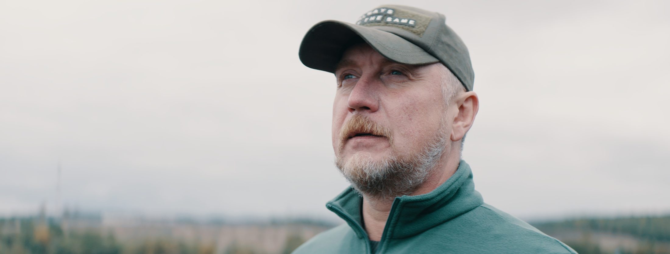 sandhills energy farmer wearing cap